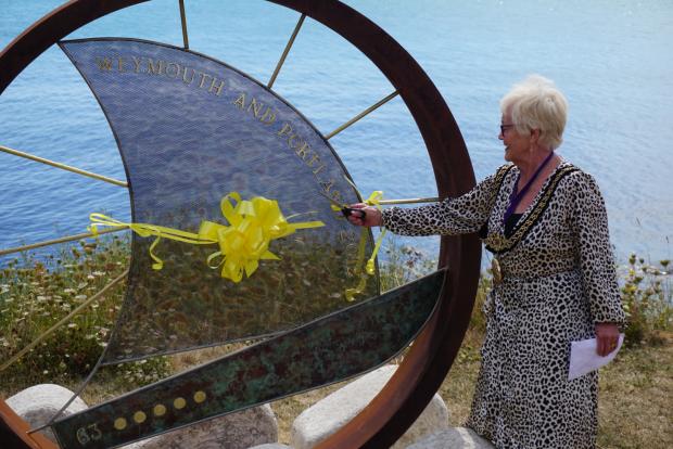 Dorset Echo: Mayor Ann Weaving cut the ribbon to officially unveil the sculpture. Picture: Cristiano Magaglio
